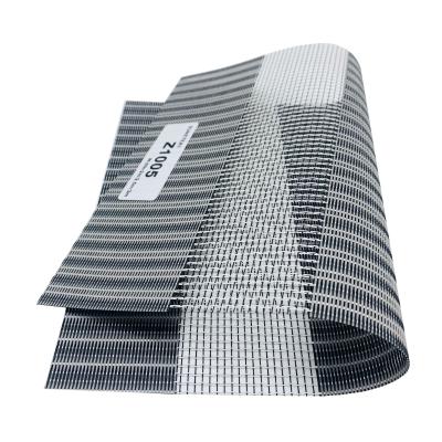 中国 注文の太陽生地のコードレスばねの巻上げ式ブラインドは耐火性を防水する影で覆う 販売のため