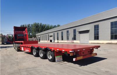 Chine Truck Trailer Flatbed Semi Trailer With 30-60 Tons Loading Capacity And 1 Tool Box Big Chamber à vendre