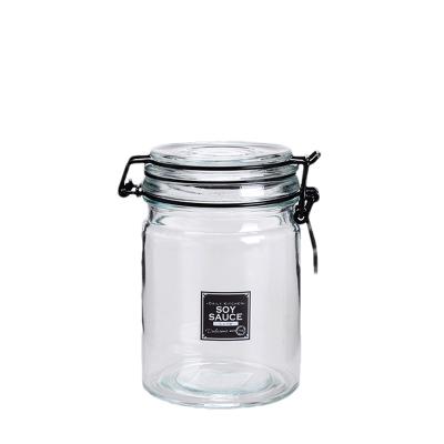 China Food Storage Empty Glass Jars Translucent 750ML Glass Sauce Jars for sale