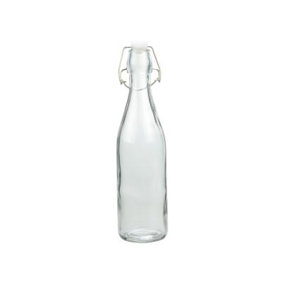 China Botellas de cerveza de vidrio con tapa de revuelo Kombucha 500 ml Botellas de leche sin BPA en venta