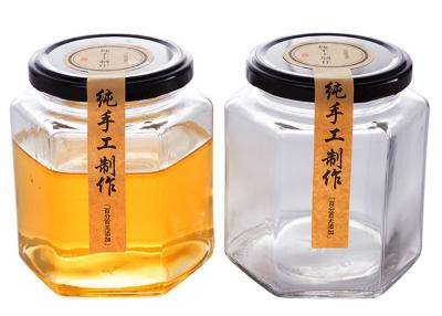 China Clear Hexagon Honey Jars Hexagon Glass Jar With Black Lids 100ml 180ml for sale