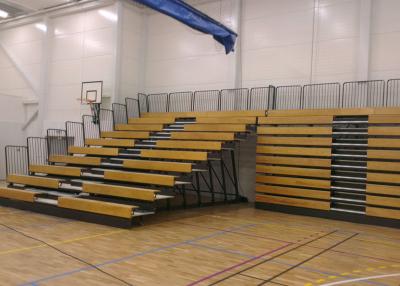 China Wooden Retractable Indoor Bleachers Polymer Bench With Guardrail System for sale