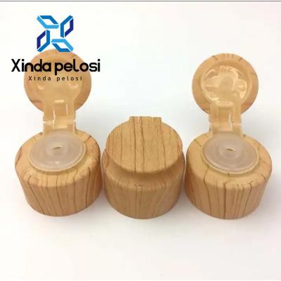 Cina 28mm Flip Top Plastic Bottle Caps Cosmetico Packaging Naturale Bambù Bottiglia Container Head in vendita