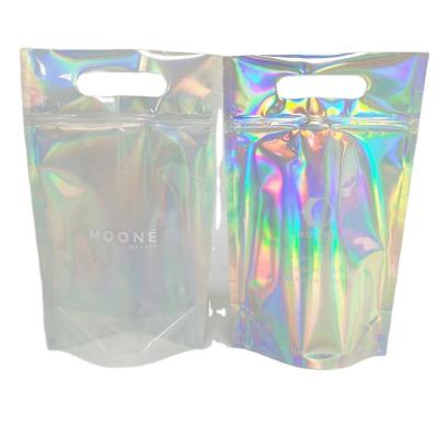 China Transparent Plastic Holographic Bags Cosmetic Aluminum Foil Mylar Bags With Zipper Handle for sale