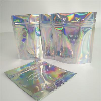 China Stand Up Cosmetic Pouch Makeup Bag Fashion Clear Shinny Bag Pouch Holographic Hologram Cosmetic Bags for sale