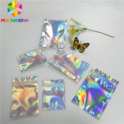 China Transparent Front Foil Packaging Bags Holographic Smell Proof Heat Seal Recyclable for sale