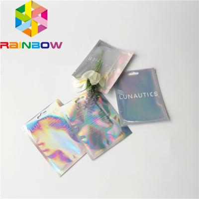 China Clear Front Foil Pouch Packaging Custom Hologram Rainbow Foil Smell Proof Mylar Bag for sale