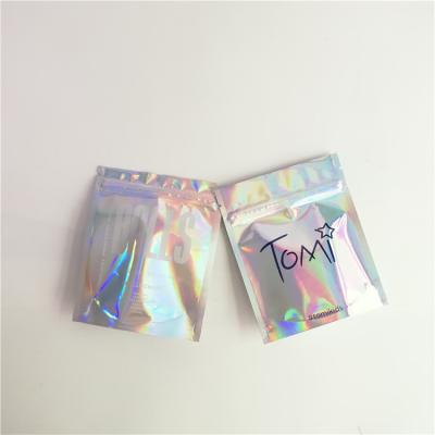 China Custom Accepted Holographic Cosmetics Packaging Bags with Zipper for sale