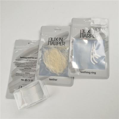 China Glossy clear front dental floss hang hole plastic bags aluminum foil customized zip lock bag packaging for sale