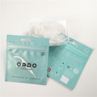 China Low MOQ clear front dental floss hang hole plastic bags aluminum foil digital print zip lock bag packaging for sale