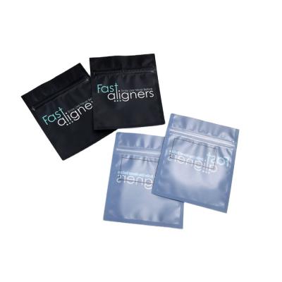 China Transparent Front Reusable Zipper Bags MOPP CMYK Aligners Mylar Packaging Bags for sale