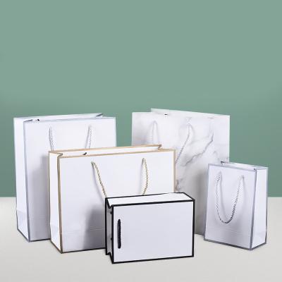 China Custom Printed Logo Paperboard Packaging Gift Shopping Paper Bag with Handles for sale