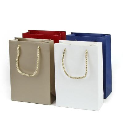 China Customized Your Own Logo Eco-friendly Shopping Packaging Twisted Handle Paper Bag for sale