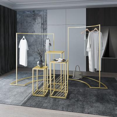 China Gold Metal Display Fixture Clothing Modern Clothes Hanging Display Rack Stand for sale