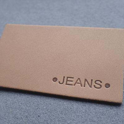China Hot Stamping Straight Cut Embossed Leather Patches For Jeans for sale