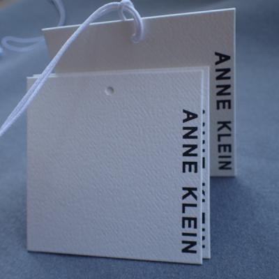 China Coated Art Paper Ultrasonic Cut 0.6mm Paper Hang Tags For Clothing for sale