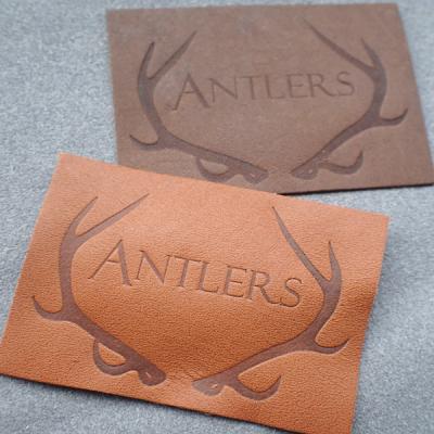 China Customized Hot Stamped Antique Copper Embossed Leather Patches for sale