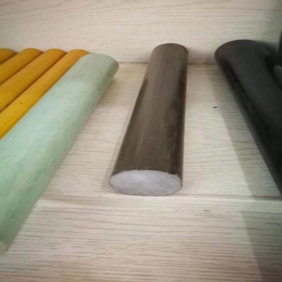China Diameter 38mm FRP round bar of brown color made from E glass roving and Iso resin for electricity insulation for sale
