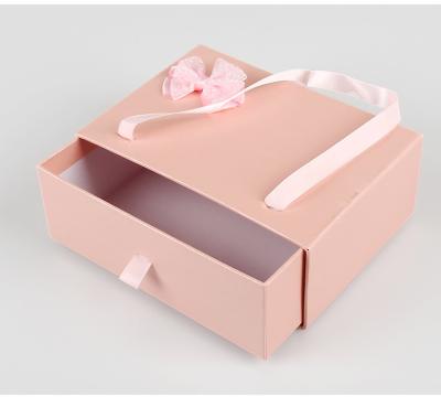 China Clothing Packaging Box Custom Logo Drawer Gift Box With Ribbon Handle for sale