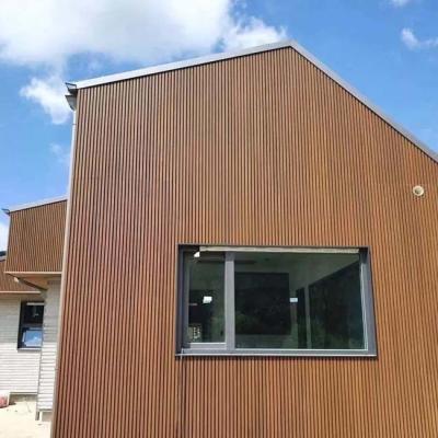 China Wood Plastic Composite Exterior Wall Panel Co Extruded Fluted WPC Cladding Panel for sale