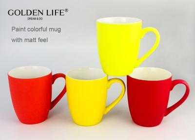 中国 New Bone China 11OZ Matt Color With Yellow Light Yellow Red Bollet Advertising Mugs 販売のため