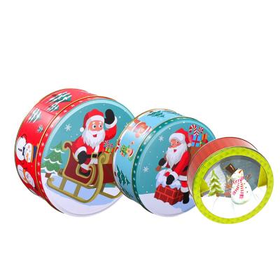 China Round Tin Cans Holiday Tin Box Sets Christmas Gift Metal Tins with Lids Printed Tin Cookie Jar for sale