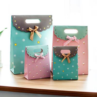 China Boutique Craft Coloured Paper Gift Bags With Self Adhesive Ribbon for sale