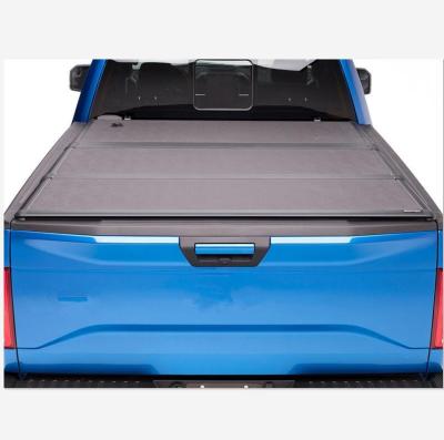 China 4X4 Car Accessories Hard Tri Fold Tonneau Bed Cover For Nissan Navara NP300 for sale