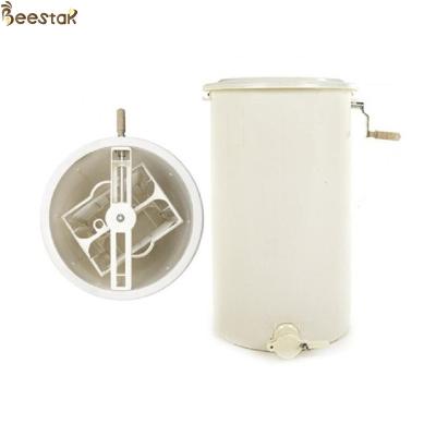 China 2 frame plastic manual honey processing extraction machine beekeeping honey extractor for sale