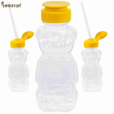 Cina Alta qualità all'ingrosso 300g Honey Jar And Spoon Plastic Honey Bear Bottles vuoto in vendita