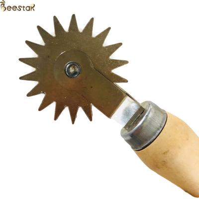 China Beekeeping Tool wooden handle Frame Manual Wheel Type Wire Embedder for beekeeping for sale