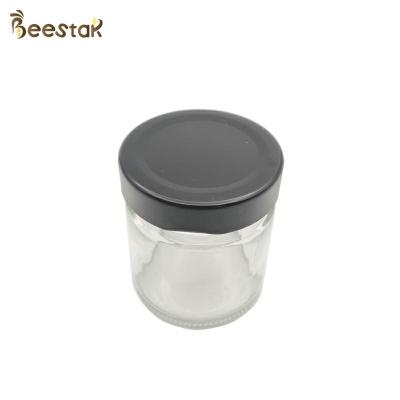 China 250ml Honey Jar And Spoon Glass Bottle For Honey Packaging for sale