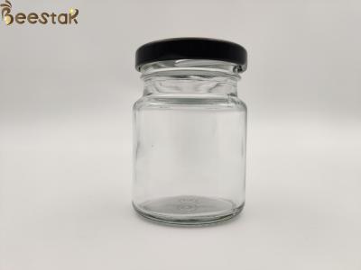 China 50ml 75ml Bird Nest Bottle Round Glass Honey Pot Glass Container Bottles With Black Lid for sale