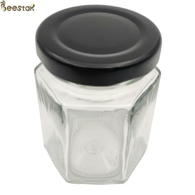 China vidrio prismático Honey Jar del hexágono del claro de la botella 45ml 65ml 85ml de 35ml Muti en venta