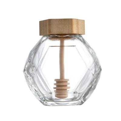 China Cubierta de Honey Hexagon Jar With Wooden del vidrio 380ML y barra de madera del chapoteo en venta
