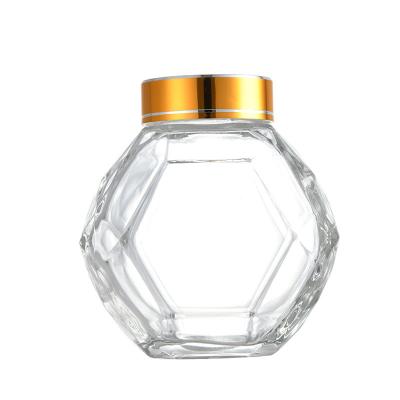 China Glashexagon-Honey Bottle With Golden Silvers 200ML 380ML roter schwarzer Metalldeckel zu verkaufen