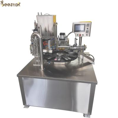 China SS304 Automatic Two Spoon Honey Packing Machine Honey Bottle Filler for sale