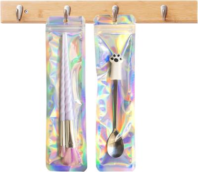 China Gift Cosmetic Packaging Bag Smell Proof Holographic Clear Cosmetic Brush Pen Mylar for sale