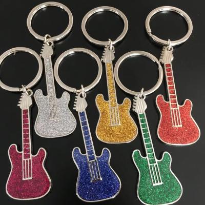 China Soft Enamel Guitar Glitter Shark Shape Keyring Custom Color Cute Cartoon Animals Keychains For Gift à venda