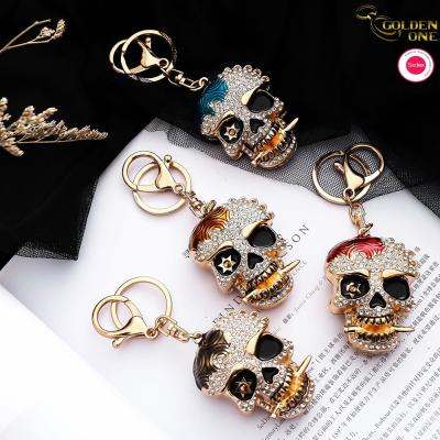China New Manufacturers European American diamond Ghost head creative epoxy metal 3d hip hop car keychain for bag pendant for sale