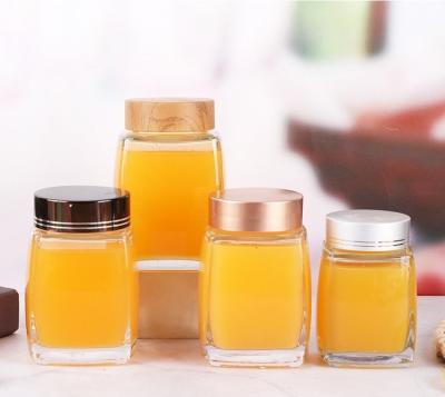 China 180ml 500ml 700ml Round Glass Cream Honey Jar with Round Shape and Glass Material for sale