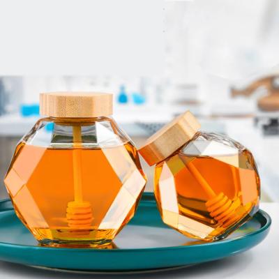 China 300ml Customized Hexagon Glass Honey Jars with Cork Sealing Type and Wooden Dipper for sale