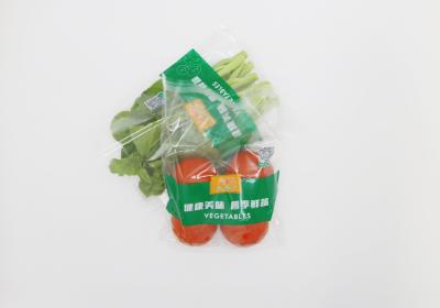 中国 袋を包んでいる注文の印刷されたパンチ穴の明確な通気性のOppのセロハンのプラスチック新鮮な野菜 販売のため