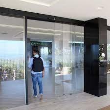 China YIWAN Light Load Pedestrian Auto Glass Door System Sliding Door Motorized 24G for sale