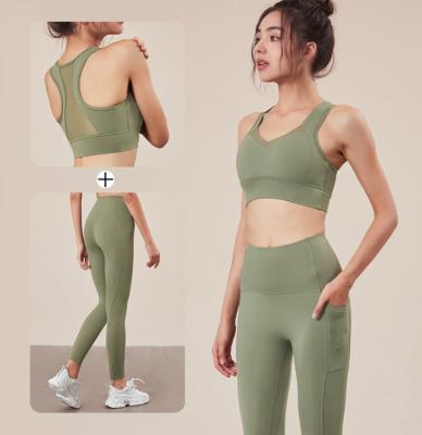 Chine Pantalon sexy de yoga de vêtements de sport de forme physique et maille noire réglée de soutien-gorge de sports avec des poches à vendre