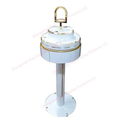 China Makeup Shop Floor Standing Rotating Cosmetics Display Rack With Drawer for sale