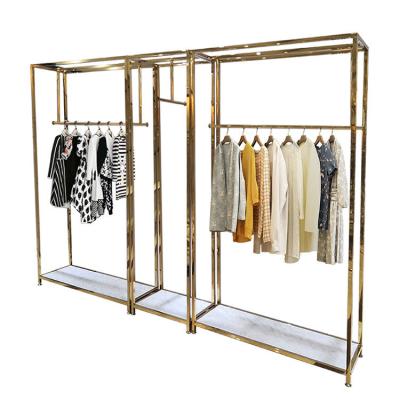 China Fashion Clothing Store Display Stand Boutique Woman Dress Display Rack Gold Metal for sale