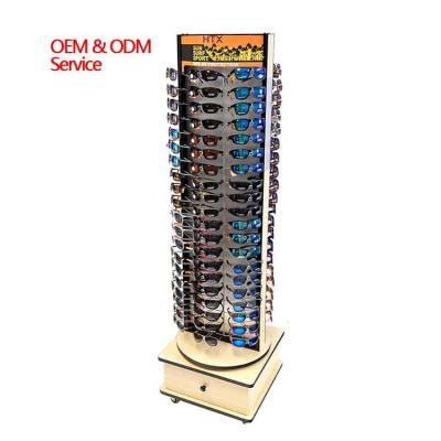 China Double Sided Wooden Rotating Sunglasses Display Stand With Storage Drawer for sale