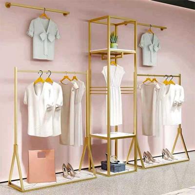 China Custom Retail Store Gold Clothing Display Rack For T-Shirt Dress for sale