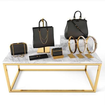 China Boutique Gold Metal Frame And Marble Display Table For Handbag for sale